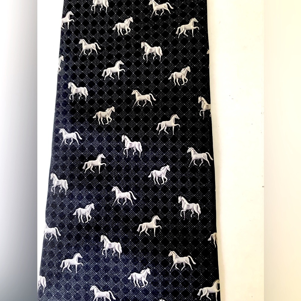 Men’s 100% silk black neck tie with a pattern of light greyishwhite color horses